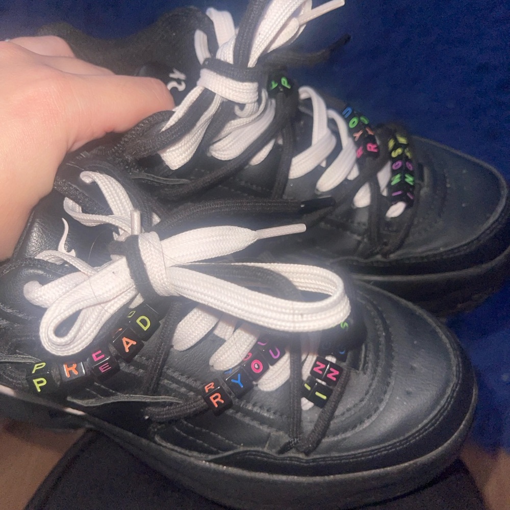 Black Sneakers with Colorful Embellishments and Thick Laces